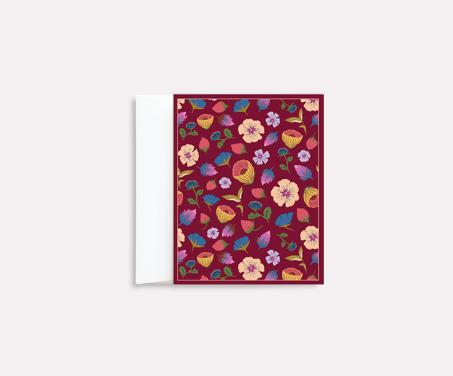 A folded notecard with a vibrant floral design in red, orange, and purple colors on a deep crimson background, displayed in an open position.