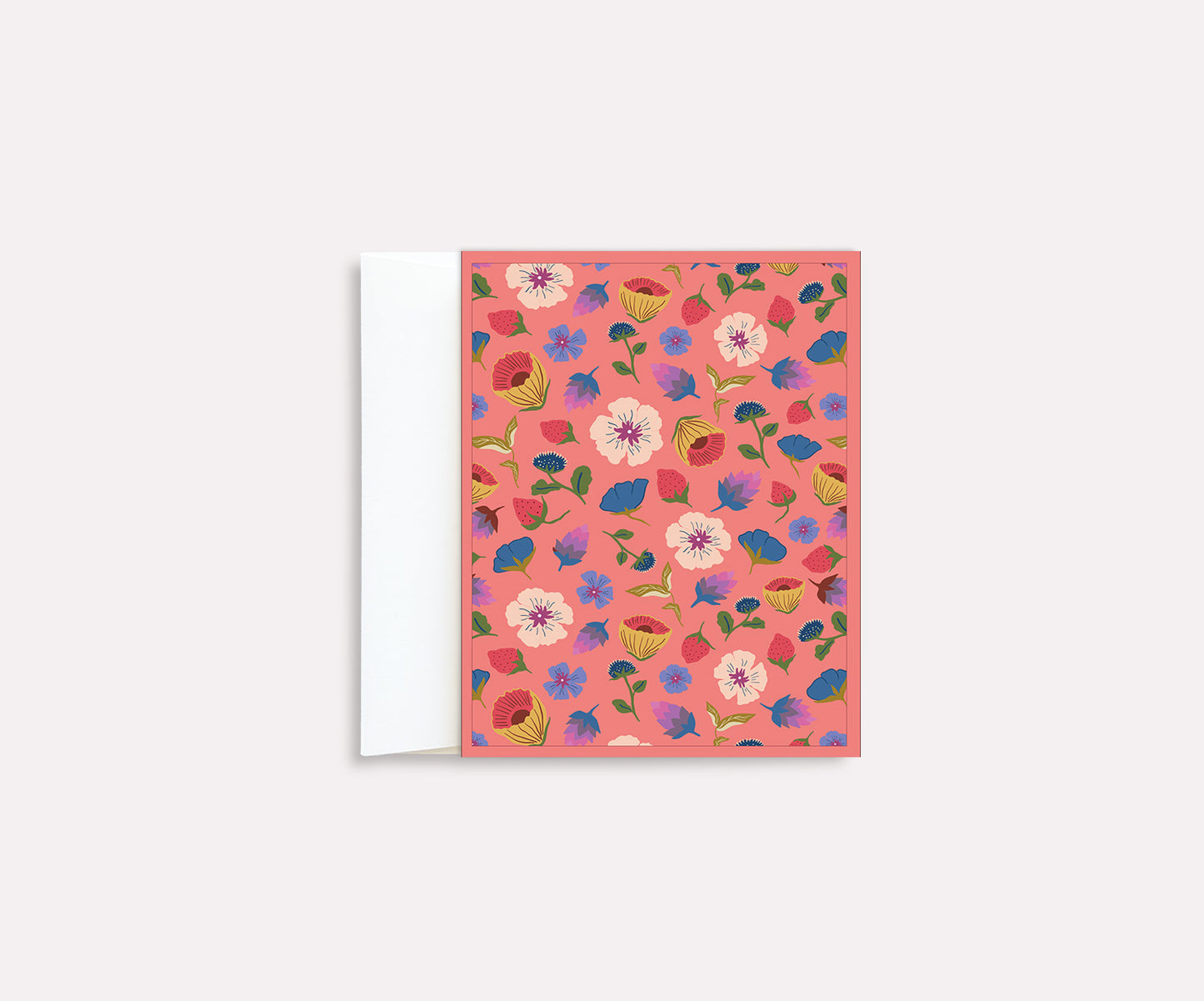 A folded notecard with a vibrant floral design in peachy pink shades, blank inside.